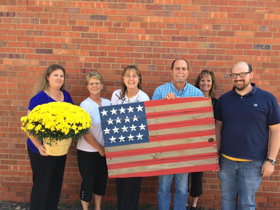 Union Colony Insurance Staff Donating an American Flag Pallet to Helping Heroes Fly